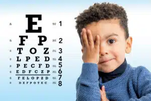 Eye Doctor performing Eye exams of Child
