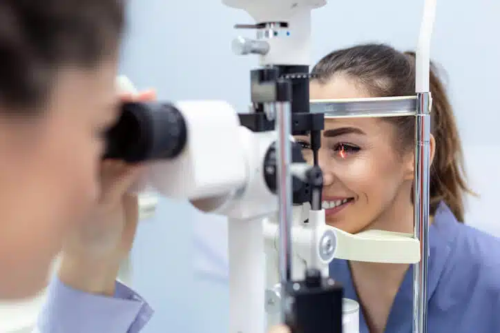 Female doctor ophthalmologist is checking the eye vision