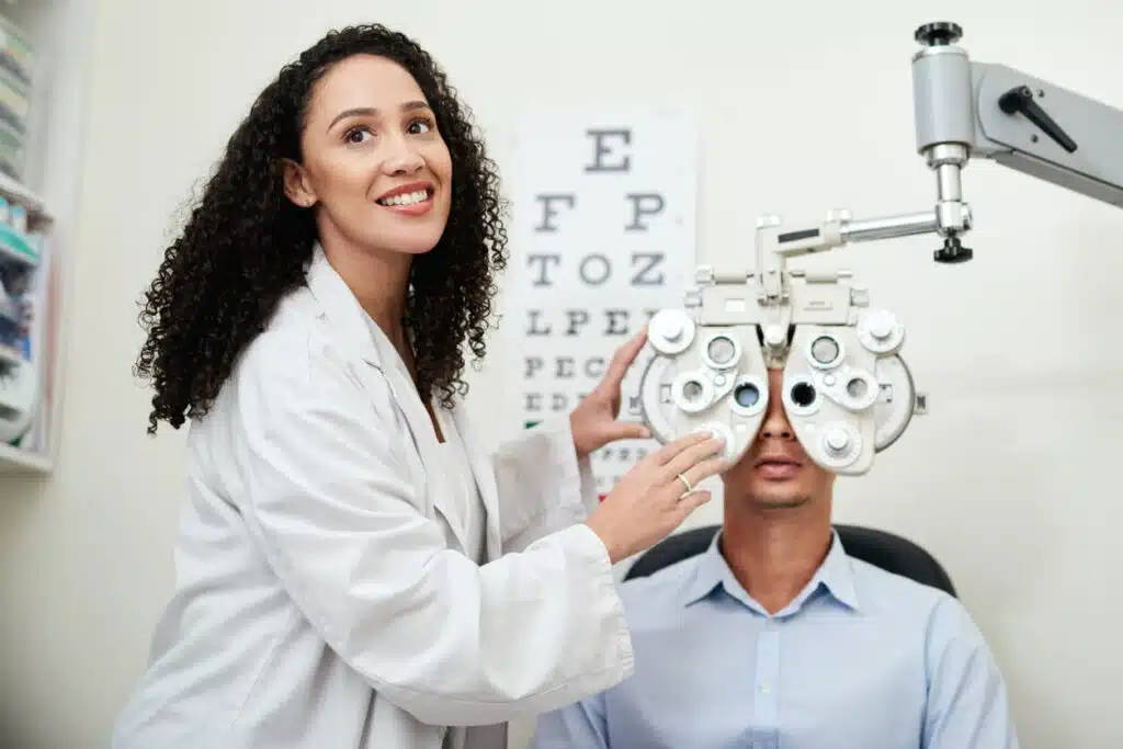 female eye doctor test eyes and optician with a man